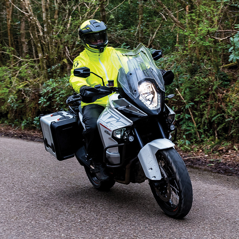 Guy wearing Scott Ergo Pro DP jacket and pant riding motorcycle